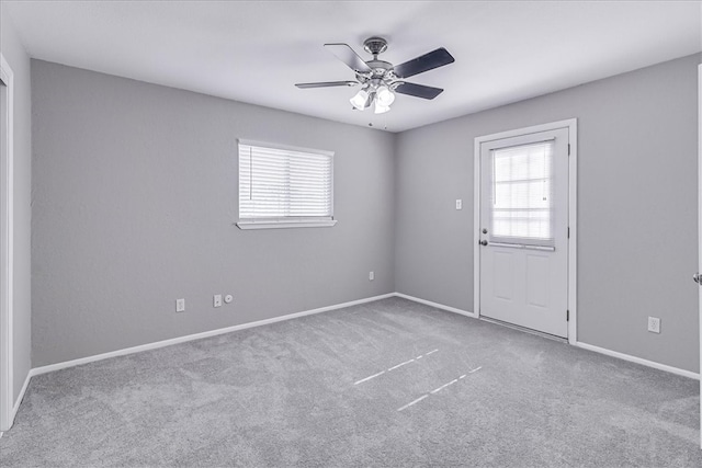 unfurnished room with carpet floors and ceiling fan