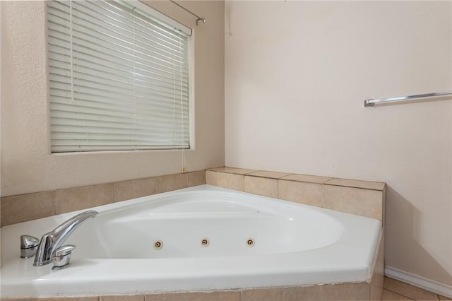 bathroom with a relaxing tiled tub