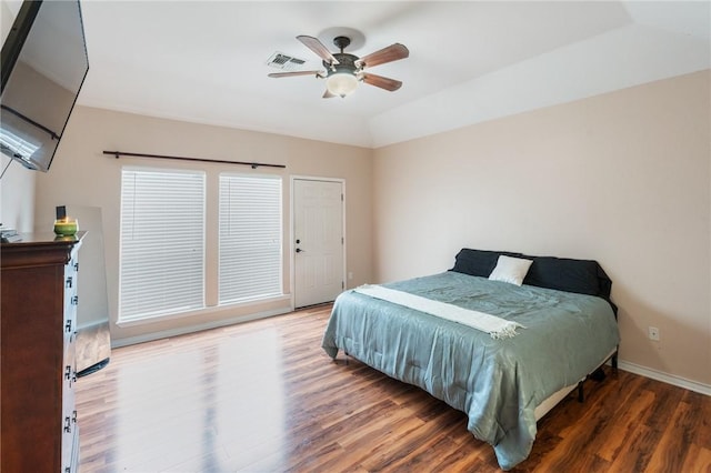 bedroom featuring vaulted ceiling, hardwood / wood-style floors, and ceiling fan