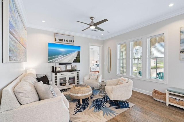 living room with baseboards, recessed lighting, ceiling fan, and wood finished floors