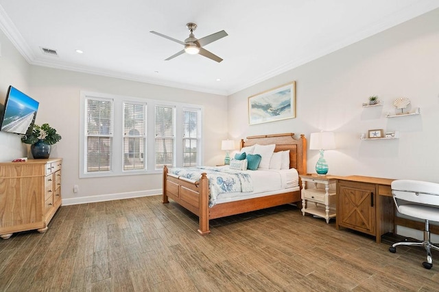 bedroom with visible vents, ornamental molding, wood finished floors, baseboards, and ceiling fan