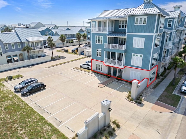 exterior space featuring uncovered parking and a residential view