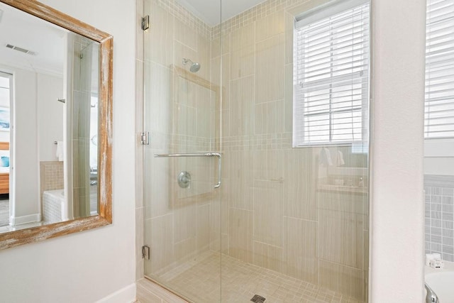 full bathroom featuring visible vents, baseboards, and a stall shower