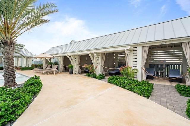 exterior space with a patio area and a pool