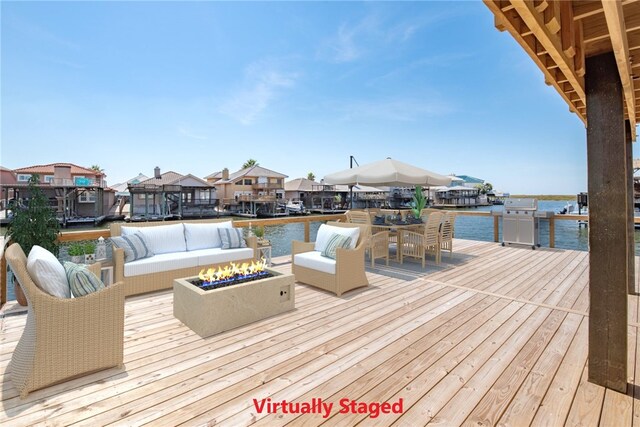 15334 Key Largo Ct, Corpus Christi, TX 78418 - deck with an outdoor living space with a fire pit, a water view, a grill, and a residential view