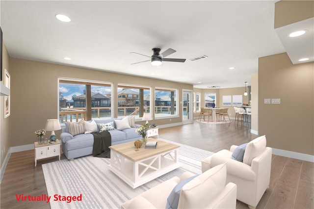 15334 Key Largo Ct, Corpus Christi, TX 78418 - living area featuring wood finished floors, baseboards, and recessed lighting