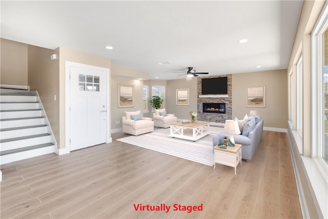 15334 Key Largo Ct, Corpus Christi, TX 78418 - living room featuring light wood-style floors, ceiling fan, stairway, a fireplace, and recessed lighting