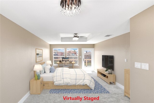 15334 Key Largo Ct, Corpus Christi, TX 78418 - carpeted bedroom featuring baseboards, a raised ceiling, and ceiling fan
