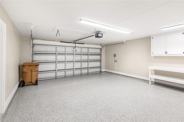 15334 Key Largo Ct, Corpus Christi, TX 78418 - garage featuring baseboards and a garage door opener