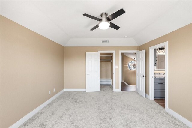 15334 Key Largo Ct, Corpus Christi, TX 78418 - unfurnished bedroom featuring carpet floors, baseboards, lofted ceiling, ceiling fan, and ensuite bathroom