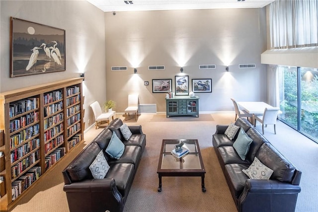 1400 Ocean Dr Unit 304C, Corpus Christi, TX 78404 - living area featuring carpet flooring and a high ceiling