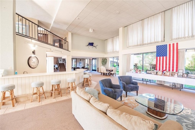 1400 Ocean Dr Unit 304C, Corpus Christi, TX 78404 - carpeted living room with a high ceiling and tile patterned floors