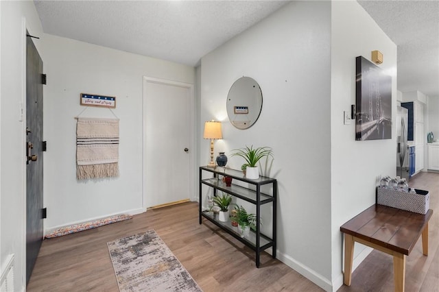 1400 Ocean Dr Unit 304C, Corpus Christi, TX 78404 - entrance foyer featuring wood finished floors and a textured ceiling