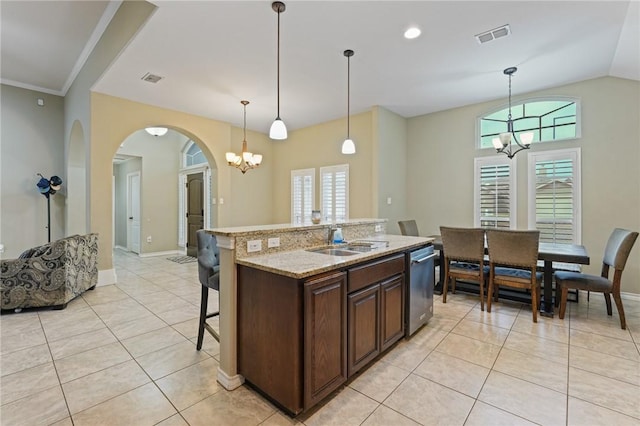 kitchen featuring light tile patterned floors, visible vents, a sink, a chandelier, and dishwasher