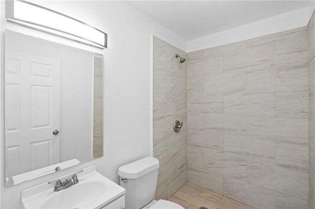1113 Annapolis Dr, Corpus Christi, TX 78404 - bathroom featuring toilet, tiled shower, and vanity