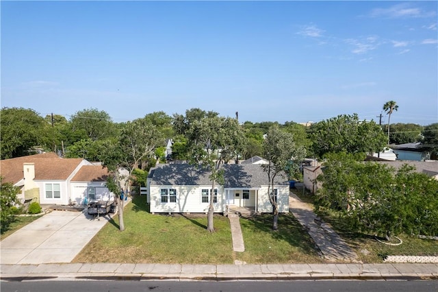 1113 Annapolis Dr, Corpus Christi, TX 78404 - view of front facade with a front lawn and concrete driveway