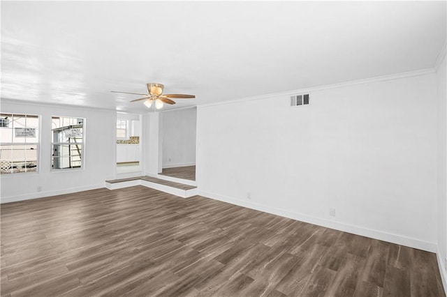 1113 Annapolis Dr, Corpus Christi, TX 78404 - unfurnished living room featuring ceiling fan, crown molding, dark wood-style floors, and baseboards