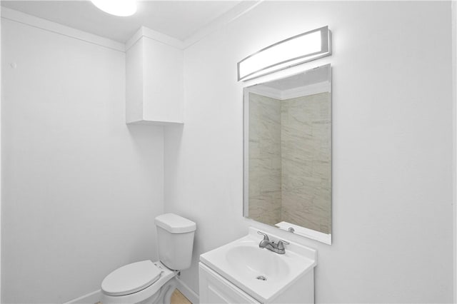 1113 Annapolis Dr, Corpus Christi, TX 78404 - bathroom featuring vanity, toilet, and baseboards