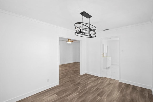 1113 Annapolis Dr, Corpus Christi, TX 78404 - unfurnished dining area featuring a chandelier, crown molding, wood finished floors, baseboards, and a ceiling fan