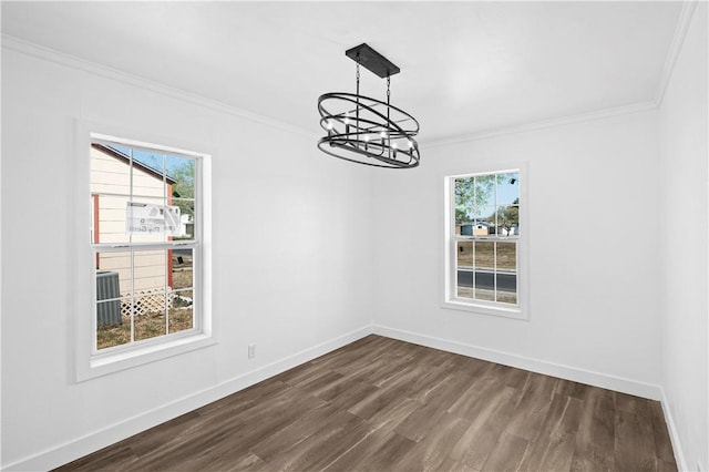 1113 Annapolis Dr, Corpus Christi, TX 78404 - unfurnished room with ornamental molding, a chandelier, dark wood-style flooring, and baseboards