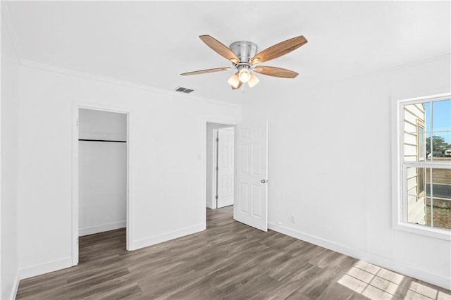 1113 Annapolis Dr, Corpus Christi, TX 78404 - unfurnished bedroom with wood finished floors, crown molding, baseboards, a closet, and ceiling fan
