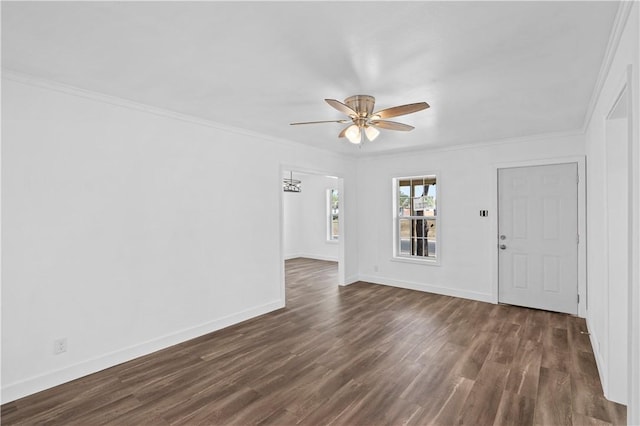 1113 Annapolis Dr, Corpus Christi, TX 78404 - unfurnished living room with ceiling fan, dark wood-style floors, baseboards, crown molding, and a chandelier