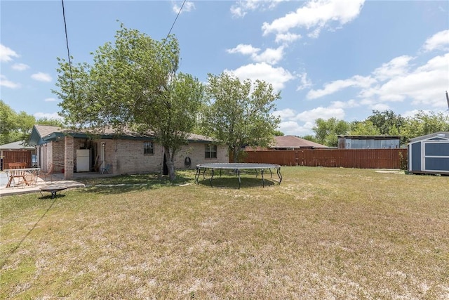 1124 Orange St, Mercedes, TX 78570 - view of yard featuring a trampoline