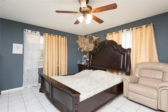 1124 Orange St, Mercedes, TX 78570 - bedroom featuring light tile patterned floors, ceiling fan, and baseboards