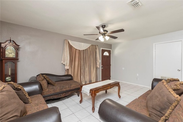 1124 Orange St, Mercedes, TX 78570 - living area with a ceiling fan, light tile patterned floors, and baseboards