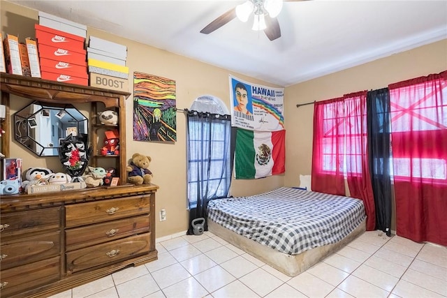 1124 Orange St, Mercedes, TX 78570 - bedroom with tile patterned floors, multiple windows, and ceiling fan