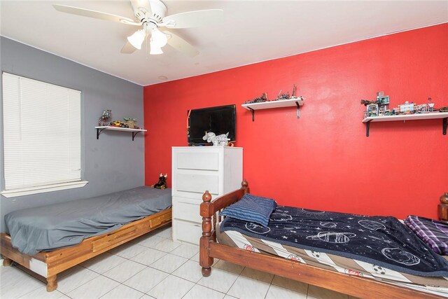1124 Orange St, Mercedes, TX 78570 - bedroom with tile patterned flooring and ceiling fan