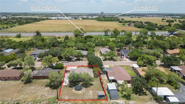 1124 Orange St, Mercedes, TX 78570 - overview of rural landscape featuring property boundaries highlighted and nearby suburban area