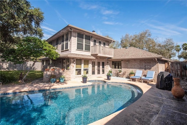 view of pool featuring a fenced in pool, a patio, grilling area, an in ground hot tub, and a fenced backyard