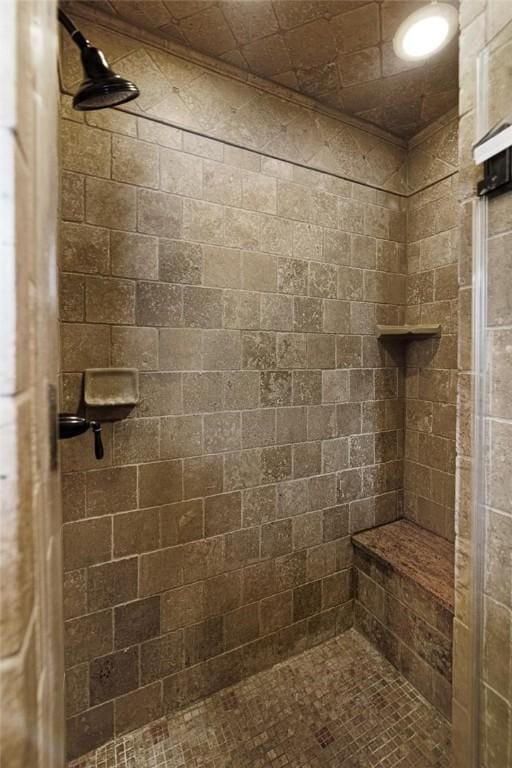 full bath with a tile shower