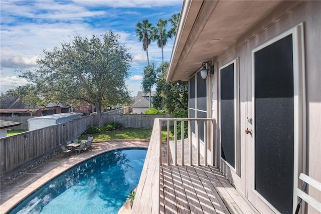 view of swimming pool featuring a fenced in pool and a fenced backyard