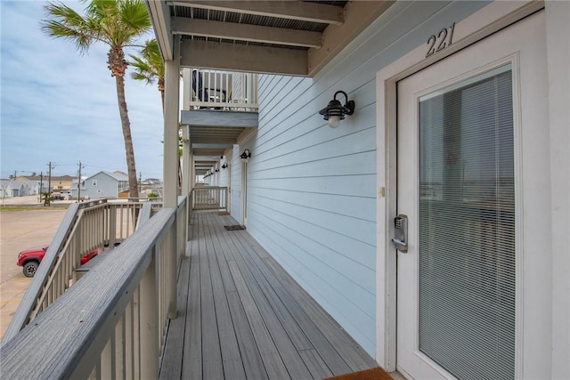 wooden deck featuring a residential view