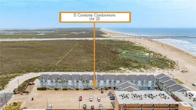 drone / aerial view featuring a view of the beach and a water view