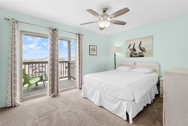 bedroom with carpet floors, access to outside, and ceiling fan