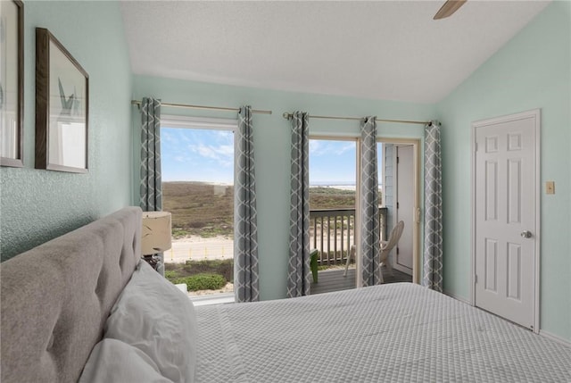 bedroom with access to outside, multiple windows, vaulted ceiling, and ceiling fan