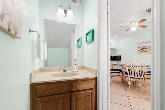 bathroom featuring a ceiling fan, visible vents, vanity, and tile patterned floors