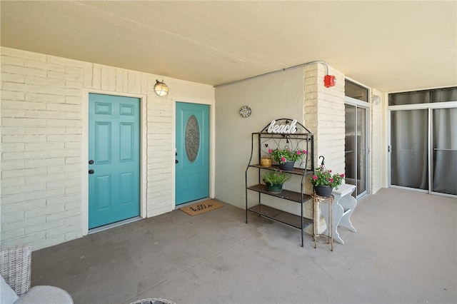 entrance to property with brick siding