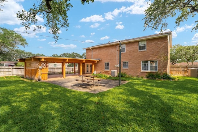 1112 David St, Sinton, TX 78387 - rear view of property featuring a patio area, brick siding, and cooling unit