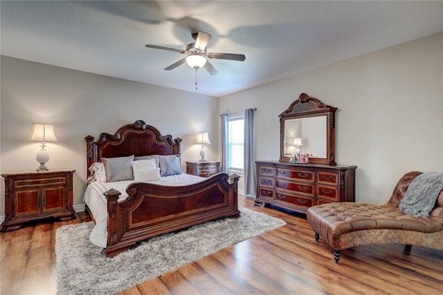 bedroom featuring ceiling fan and hardwood / wood-style flooring