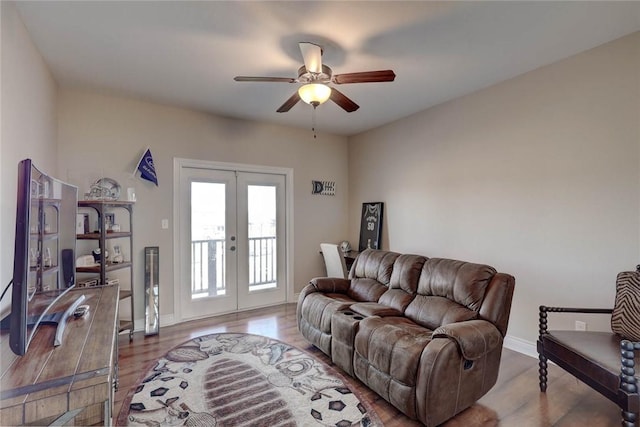 living room with french doors, ceiling fan, and wood-type flooring