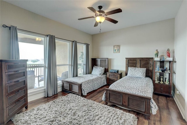 bedroom with ceiling fan and dark wood-type flooring