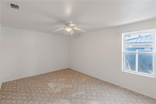 2406 Lakeview Dr, Rockport, TX 78382 - carpeted spare room featuring ceiling fan and baseboards