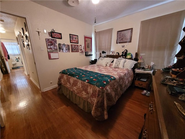 bedroom with hardwood / wood-style floors