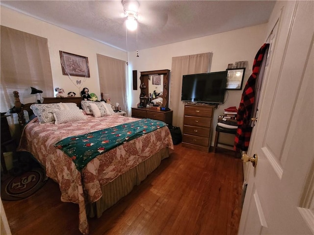 bedroom featuring hardwood / wood-style floors and ceiling fan