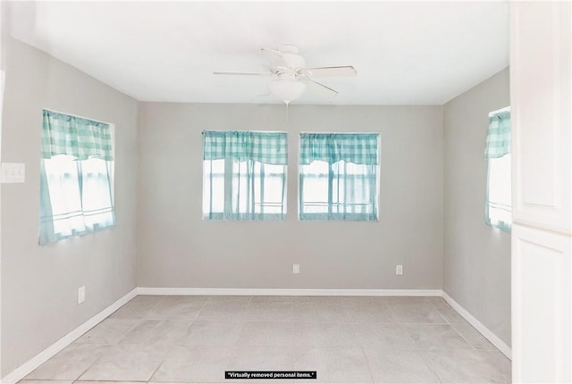 unfurnished room featuring ceiling fan