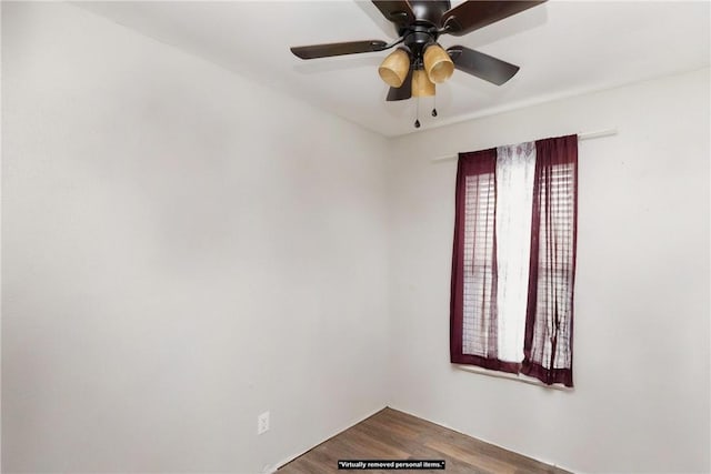 spare room featuring hardwood / wood-style flooring and ceiling fan